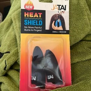 Heat shield for finger when using hot tools